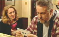 Eileen shows Tommy the tickets.