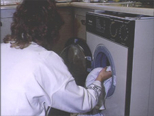 Putting clothes in Washing Machine, Housewife, 1990