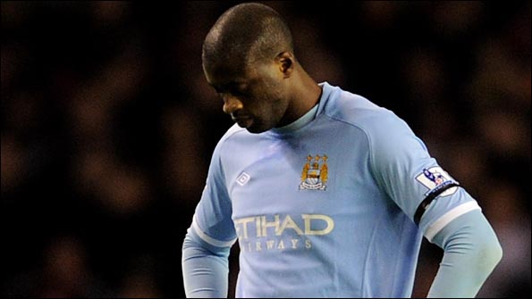 Yaya Toure hangs his head in dismay