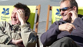 Stuart and Mark giggle on some deckchairs
