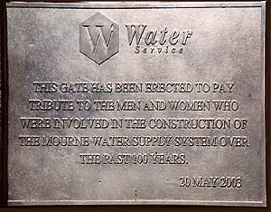 The bronze plaque which was unveiled at the Silent Valley Visitor Park, which says: This gate has been erected to pay tribute to the men and women who were involved in the construction of the Mourne water supply system over the past 100 years. 20th May 2003