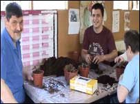 Chris(R) with two of his students