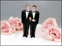 Two grooms on wedding cake