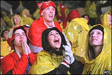 Canadian ice-hockey fans celebrate a goal