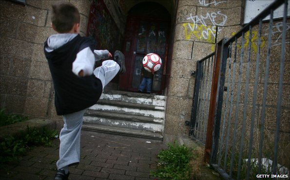 Child playing football