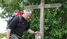 Derek hops over a stile