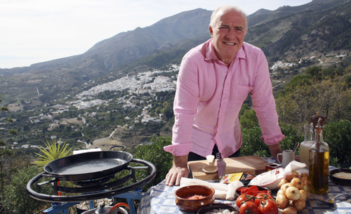 Rick Stein cooking outside.