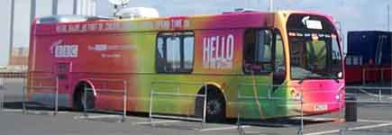 Multi-coloured BBC community bus