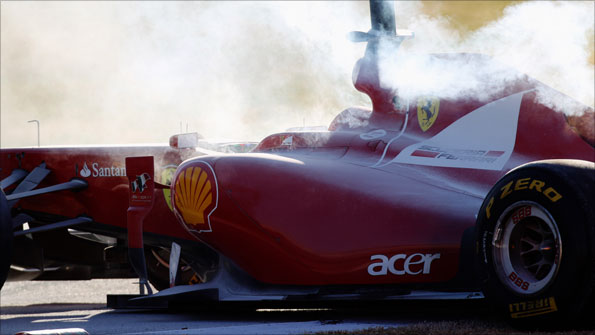 Felipe Massa's Ferrari suffers an engine problem during winter testing