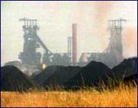 Image of a factory producing smoke