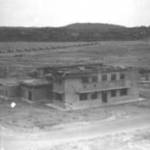 Flight Offices at China Bay, Trincomalee, Ceylon in 1942. Hurricanes on the runway in background.