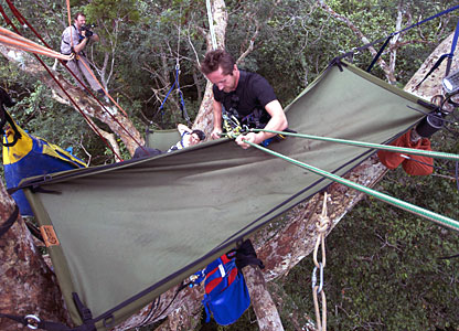 Bruce Parry in the trees with his hammock