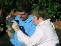 volunteers watch film in walled garden