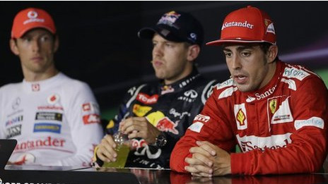 Fernando Alonso (kanan), Sebastian Vettel (tengah) dan Jenson Button