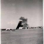 Hudson crashes into petrol dump in the act of taking off on a detachment prior to El Alemein. Photographs of the crash and the burial of the victims. Hudson crashes whilst taking off from El Khanka to go on detachment a few days previous to the start of the ‘Big Push’ of 1942. It carried a crew of eight five were killed in the kite three got out, two of them died of burns later so there was only one survivor (Paulger) a terrible tragedy.