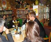 students & peter jones sitting round table