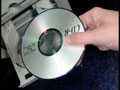 Photo of a cd-rom being put into a computer