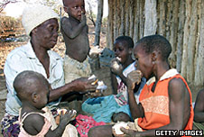A family in Zimbabwe, Africa, sharing some bread