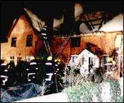 Burning thatched building