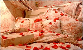 Picture: Delicate prints and rose petals create a Valentine's love nest.