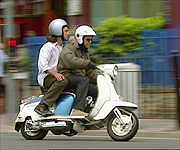 Neil getting into the swing of things, taking a ride on a moped.