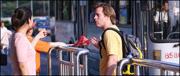 A girl gives a man transport advice