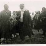 Group of Syrian Arabs gathered round British aircraft. Typical Bedouin types.