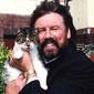 Wallace Rollins with his cat 'Wee face'