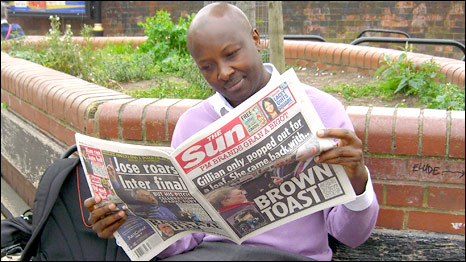 Joseph Warungu reading the Sun newspaper
