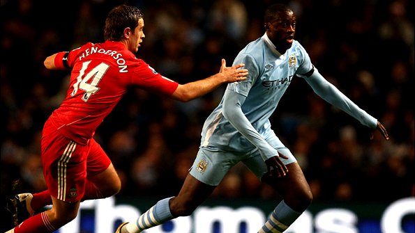 Yaya Toure goes past Jordan Henderson
