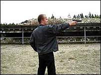 A still from a video from YouTube of Matti Juhnai Saari firing a gun