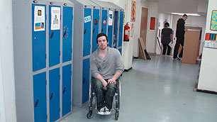 Hollyoaks actor Peter Mitchell in a corridor at Hollyoaks High School
