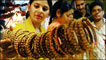 Indian women look at bangles 