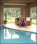 Adrian relaxing by his swimming pool