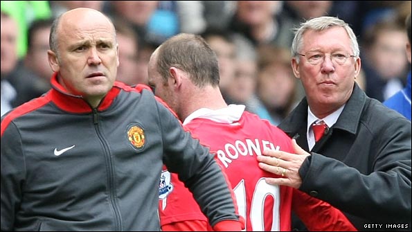 Wayne Rooney gets a pat on the back from Sir Alex Ferguson