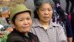 A Two elderly women at a market - Bei Bei.