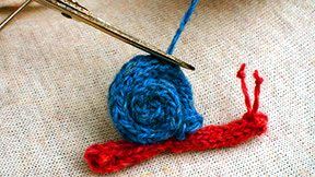 Finished woollen snail