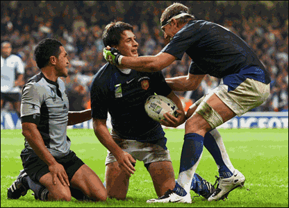 Yannick Jauzion gets a hug after scoring the match-winning try for France