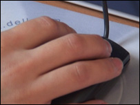 Hand on computer mouse