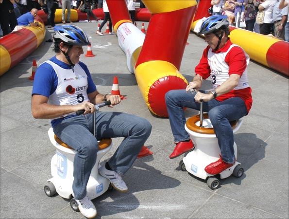 Men racing toilets