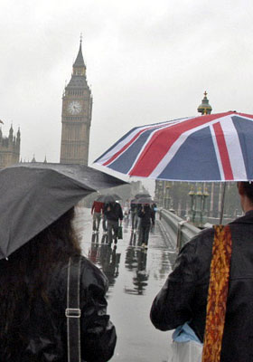 People walking on Westminster bridge in the rain.