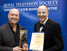 Steve Paton receives his award for Best Camerawork from Inside Out presenter Chris Jackson