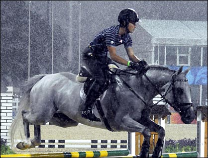 Japanese rider Yoshiaki Oiwa practices in the rain on Georgeous George