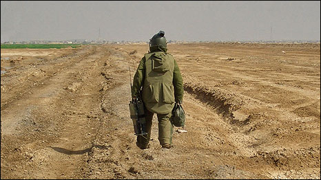 Kevin Ivison taking the "longest walk" towards a bomb in Iraq. Photo: Jim Hutchinson