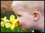 Boy and flower by Caroline Baker