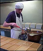Pouring the sugar syrup to make Kendal mint cake