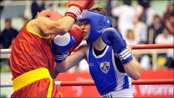 Irish world champion Katie Taylor (right) would be a strong contender for gold in 2012 if women's boxing is approved