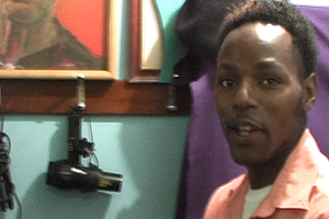 Claude explains his love for music, hairdressing and playing the merembe.