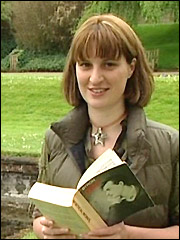 Sarah reads a book in the grounds of Newstead