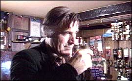 Ted Hughes in a pub with pint in hand